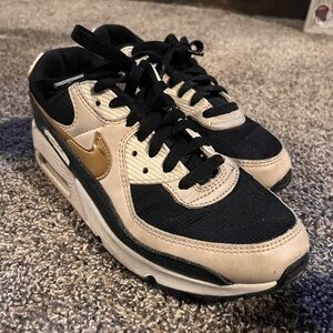 Nike women’s Air Max 90 black metallic gold